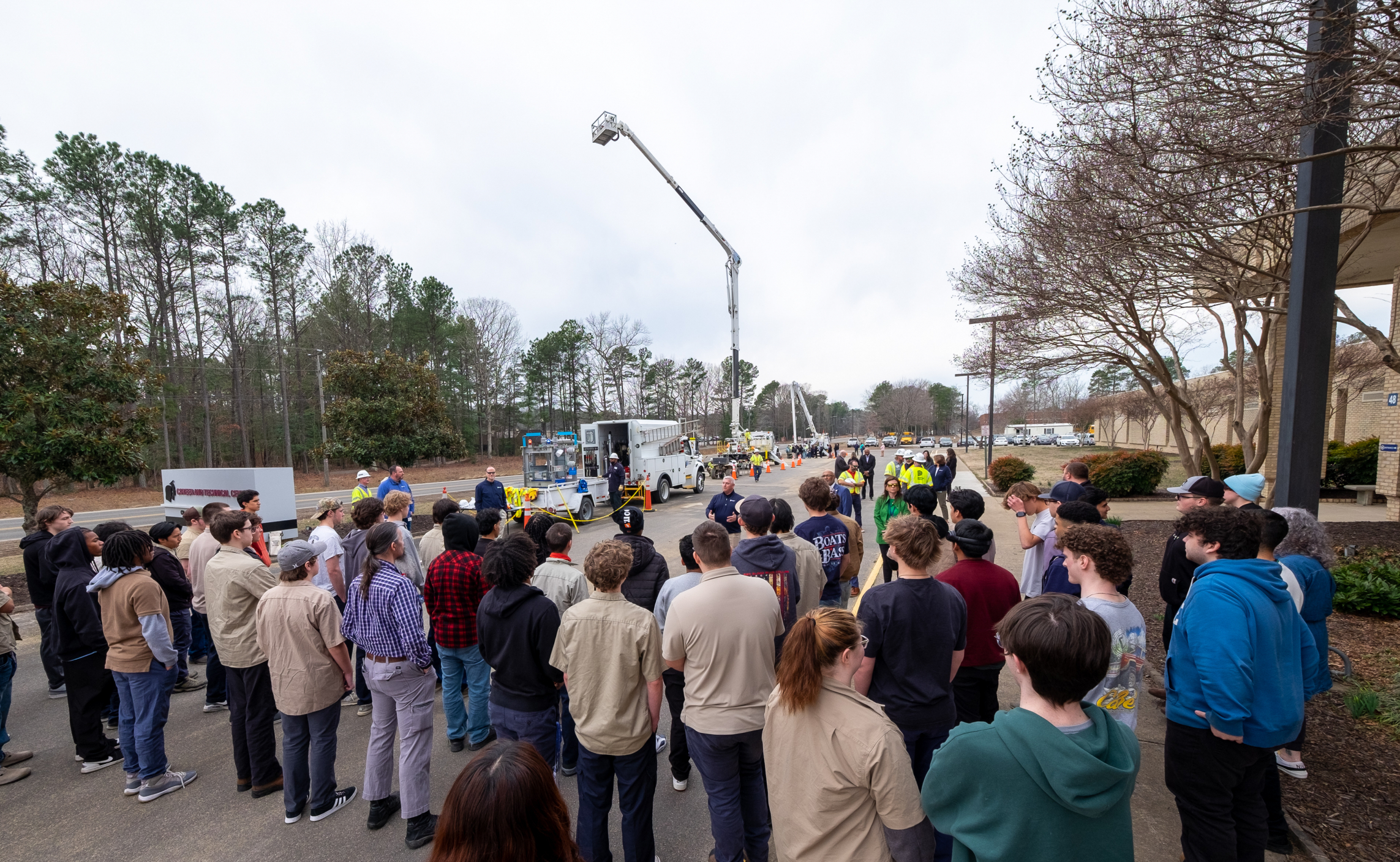 Chesterfield Technical Center learners gather around Dominion Energy trucks